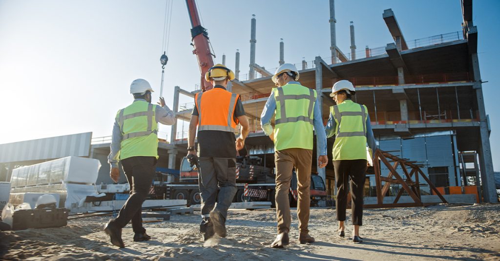 NexGen team walking toward constructio site